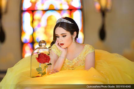 Beautiful quinceañera with a yellow dress of beauty and the beast. Photo by Quinceanera Photo Studio 305.918.4040